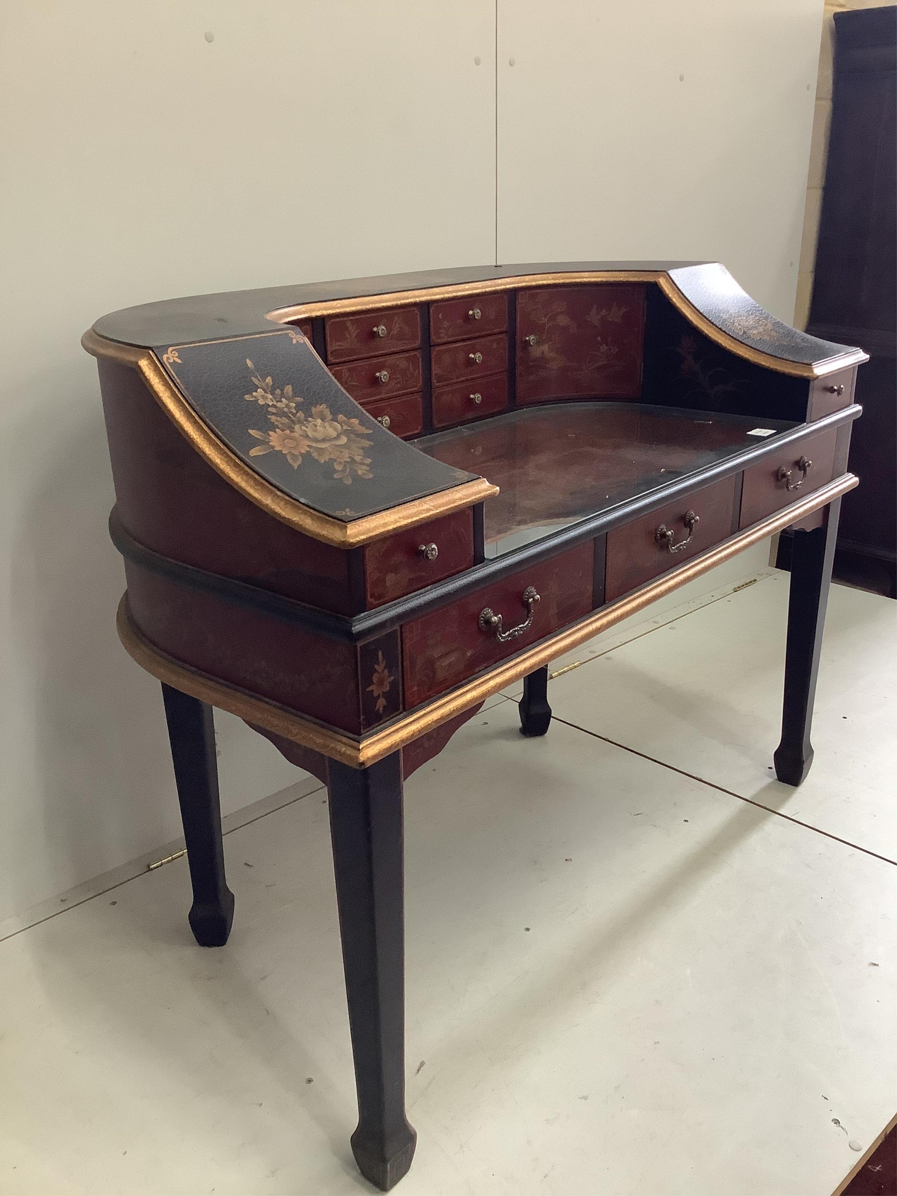 A reproduction chinoiserie painted Carlton House type desk, width 126cm, depth 64cm, height 89cm. Condition - fair